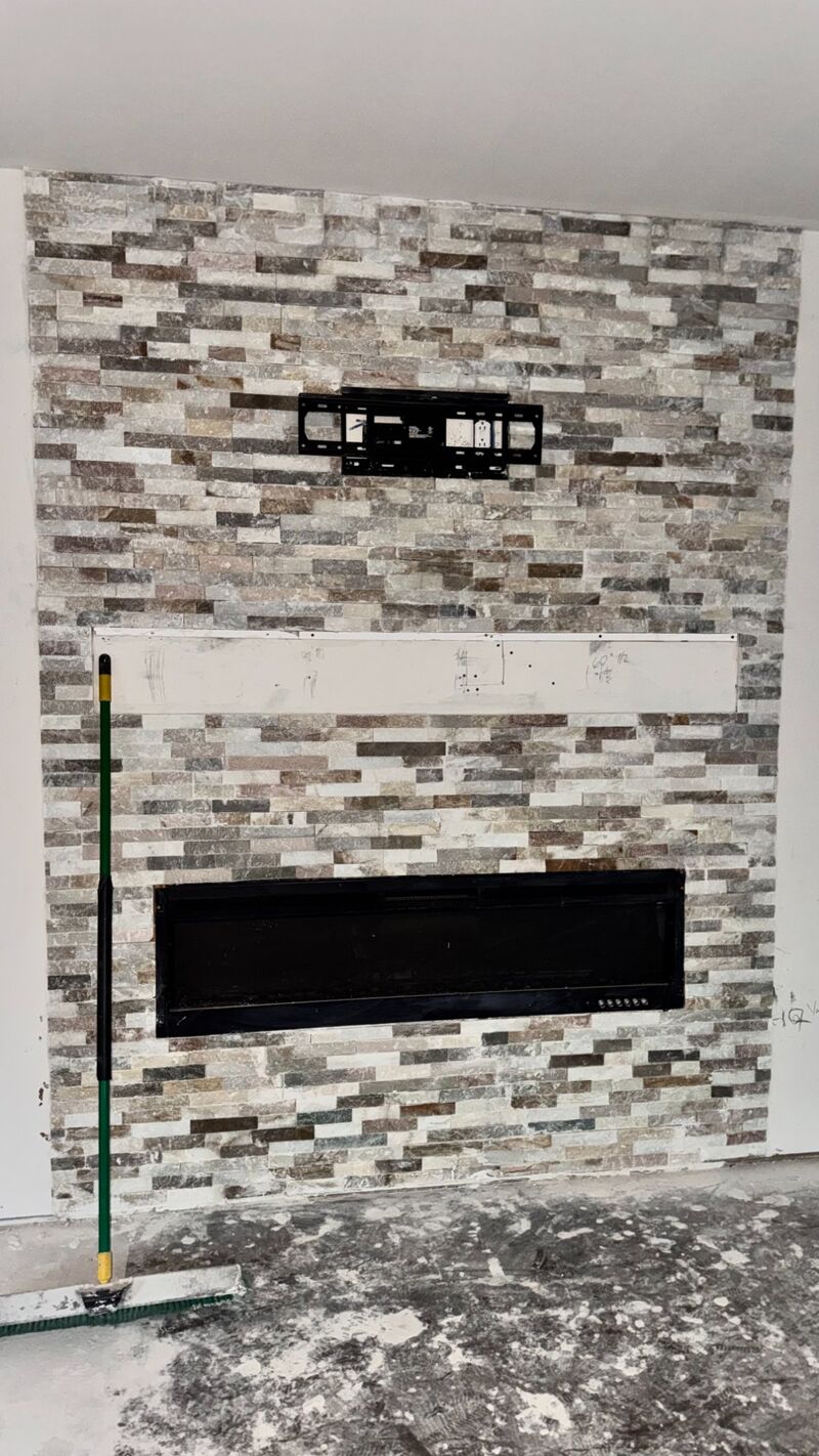 Stone accent wall with fireplace
